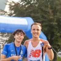 Two participants posing with their event medals